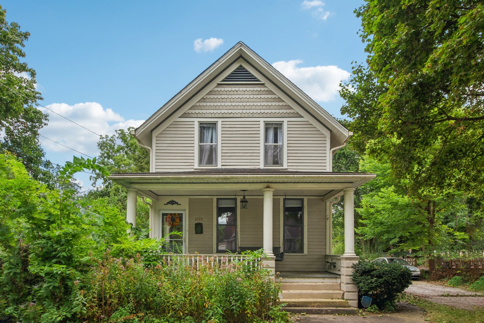 a front view of a house with garden