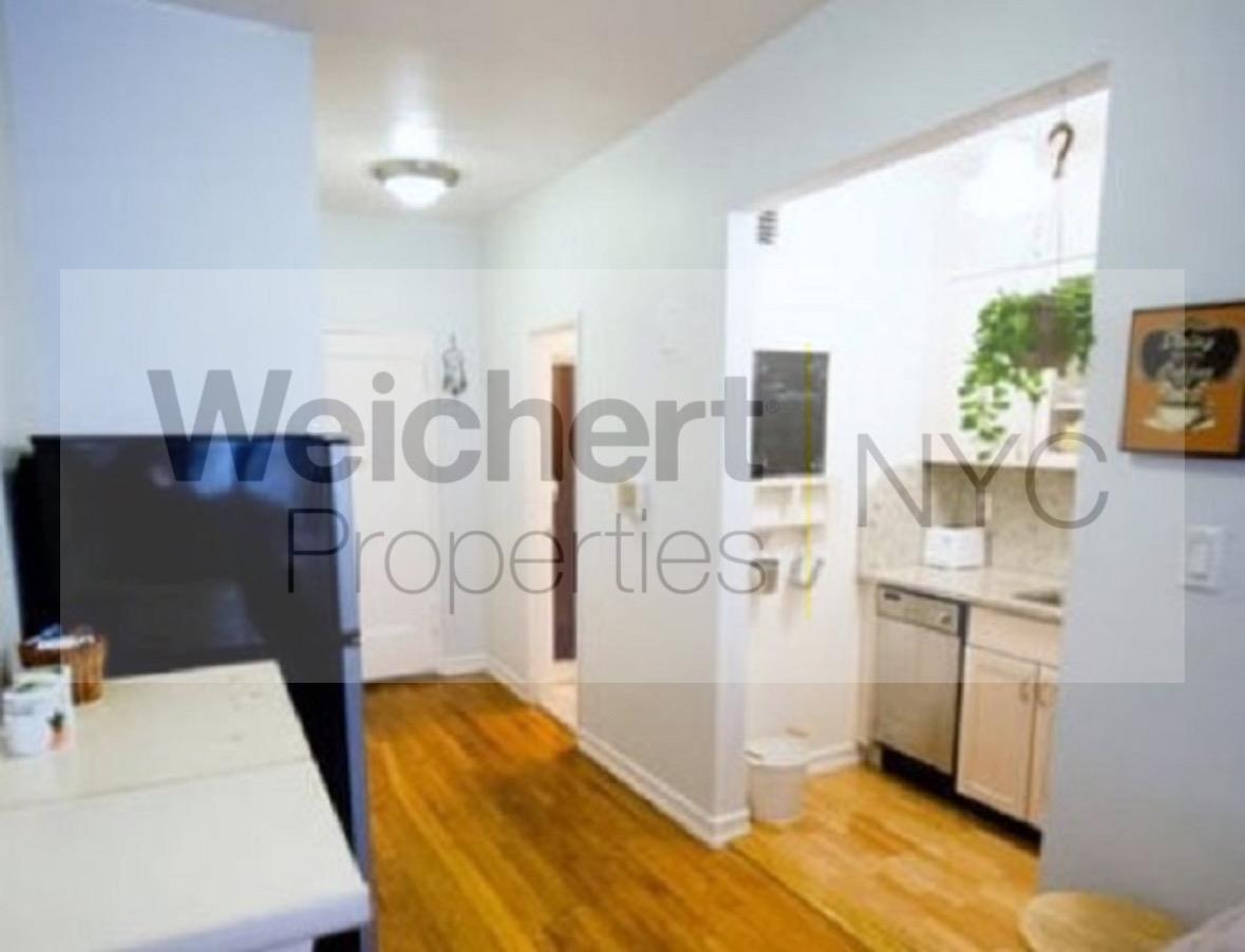 a view of living room with furniture and flat screen tv