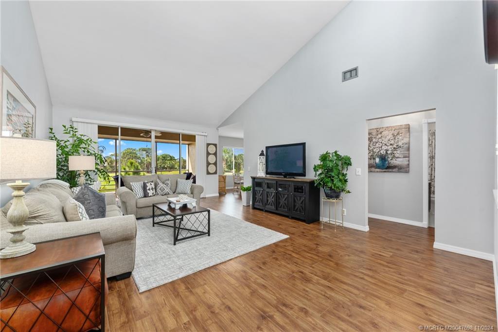 a living room with furniture fireplace and a flat screen tv