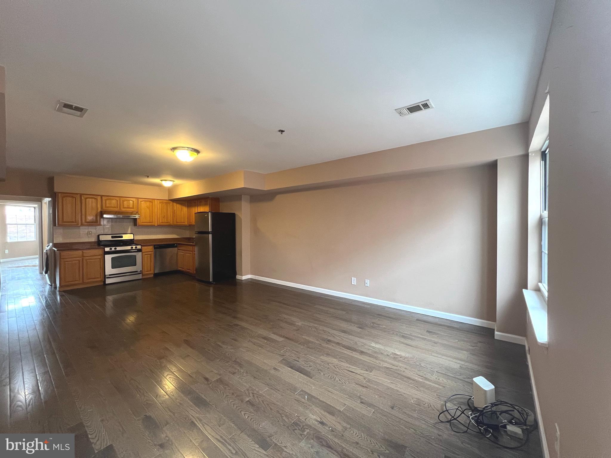 a view of kitchen with furniture and wooden floor