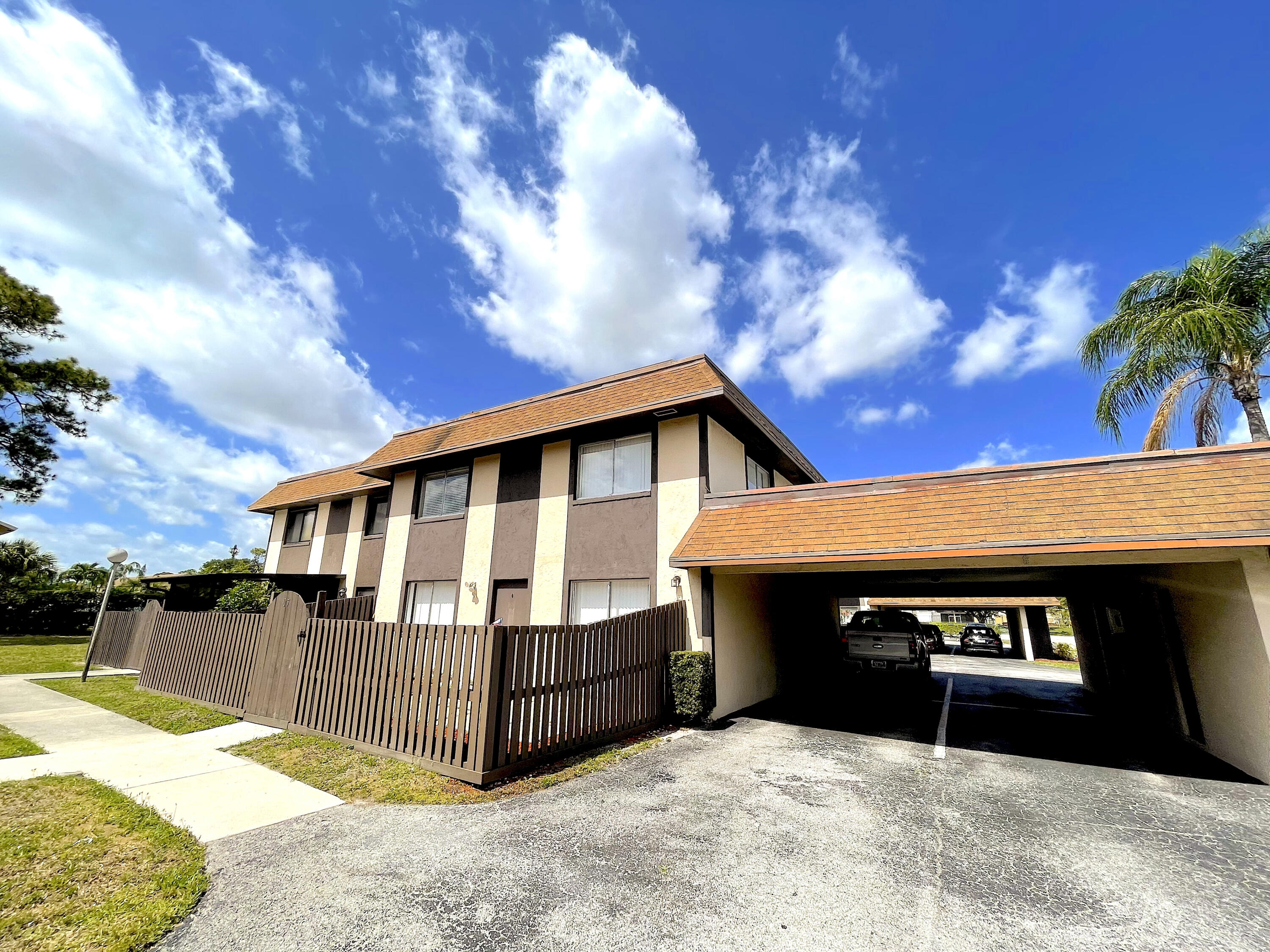 a front view of a house with a yard garage and entertaining space