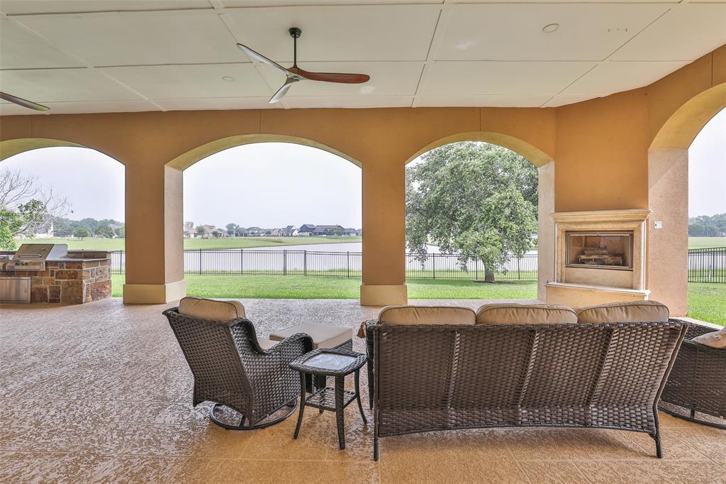 a view of a patio with a table and chairs