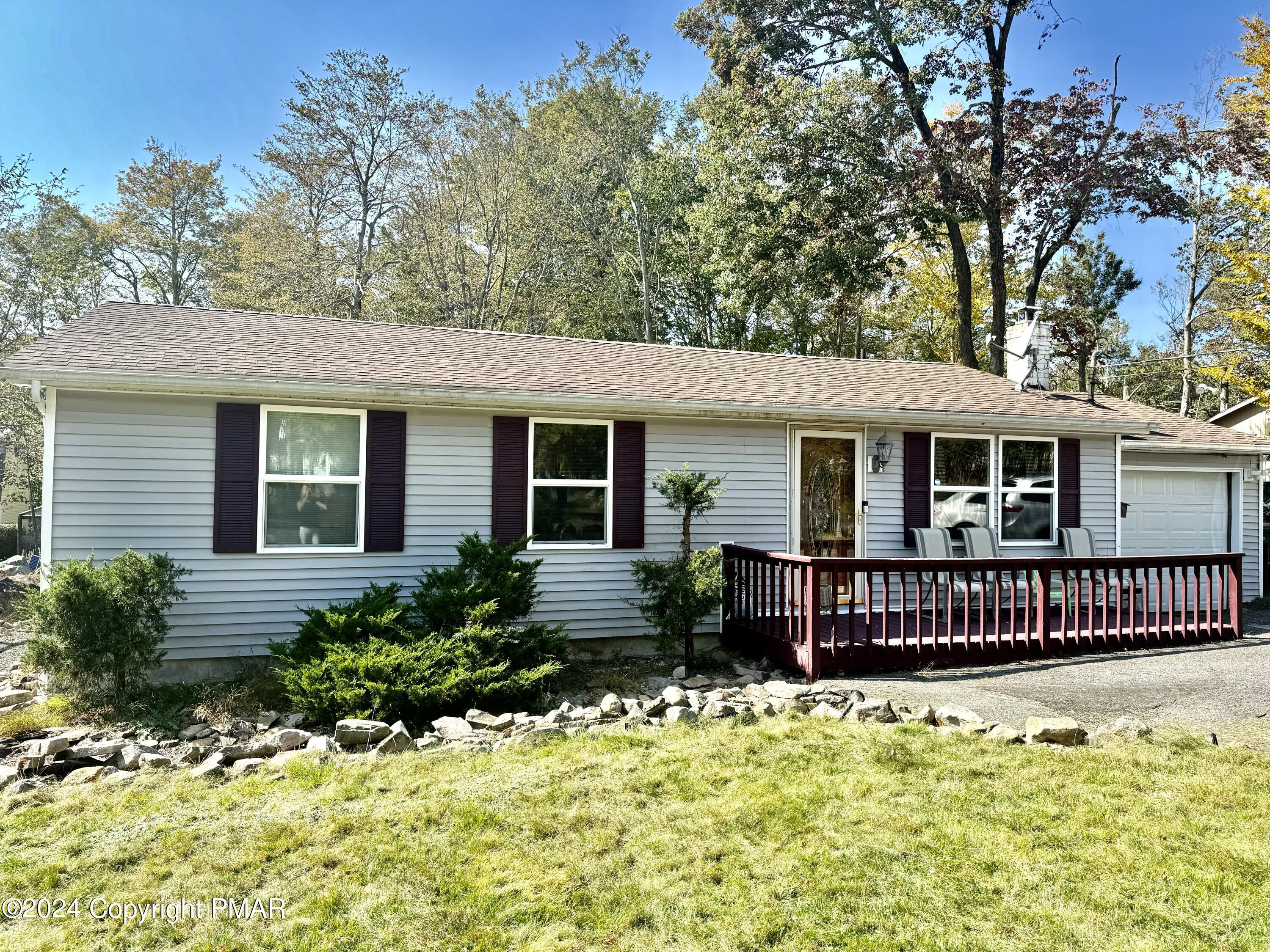 front view of a house with a yard