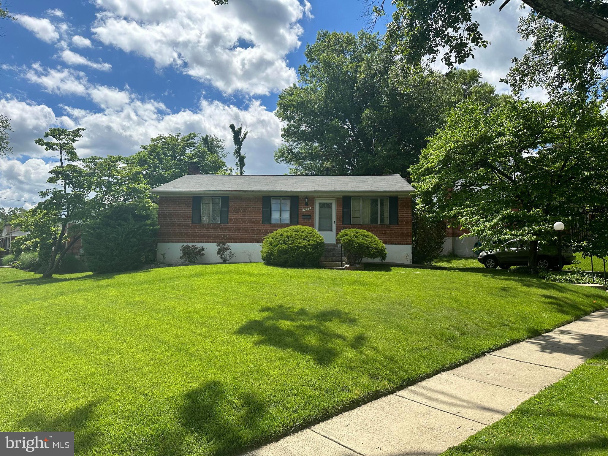 a view of a house with backyard sitting area and garden