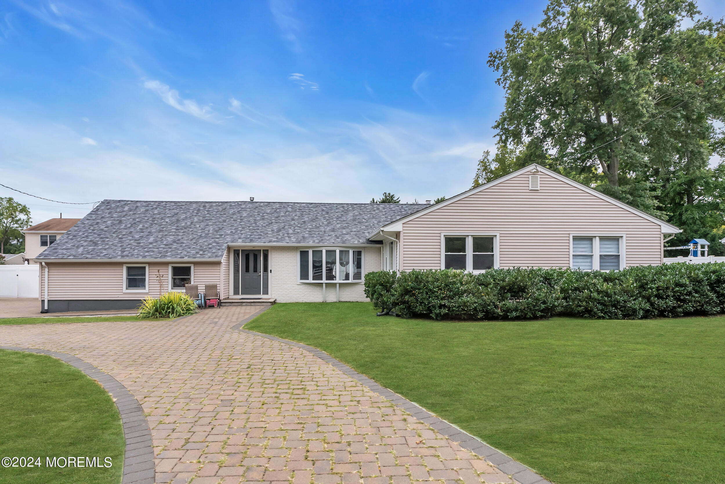 a view of house that has a yard