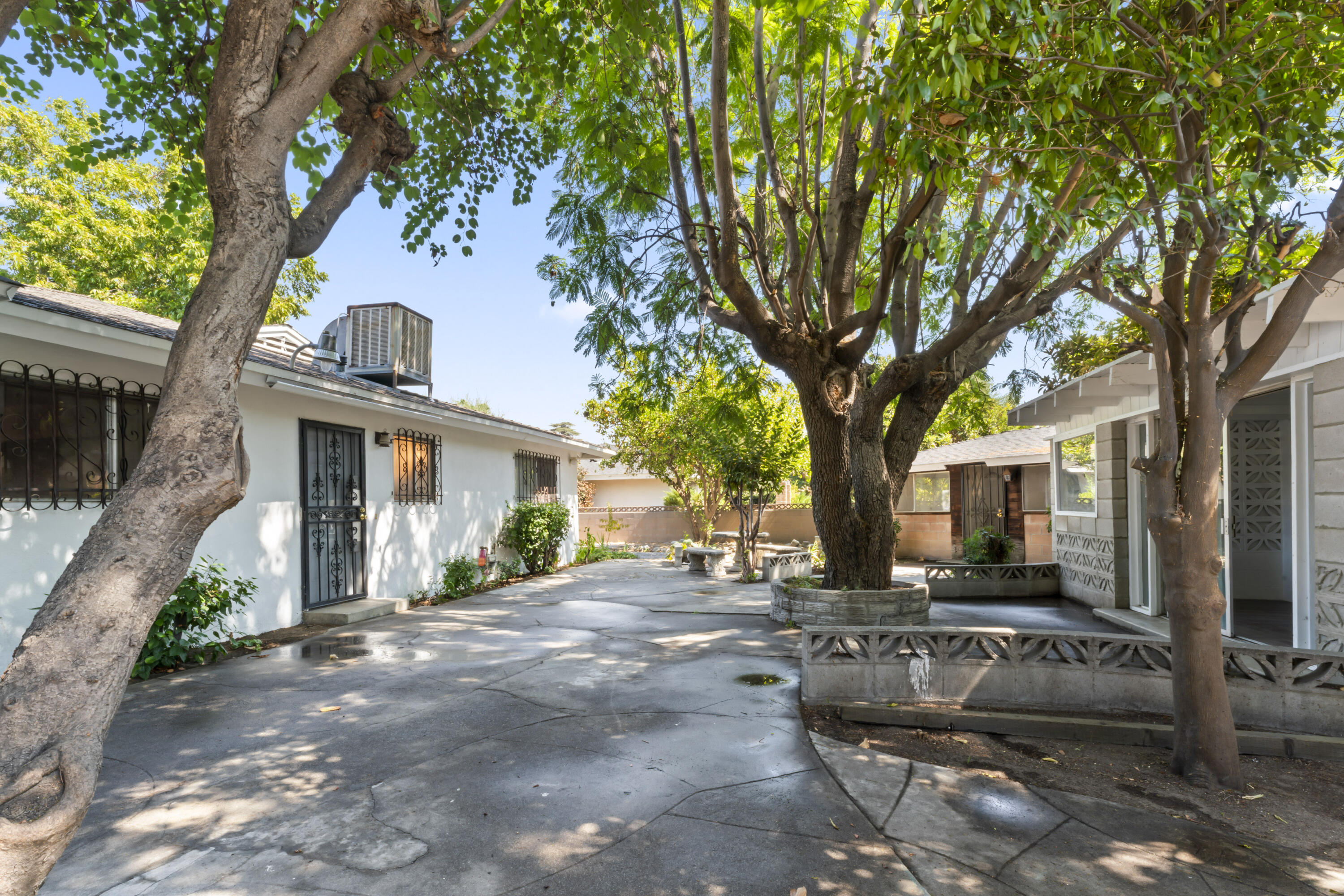 a view of a house with a tree in the background