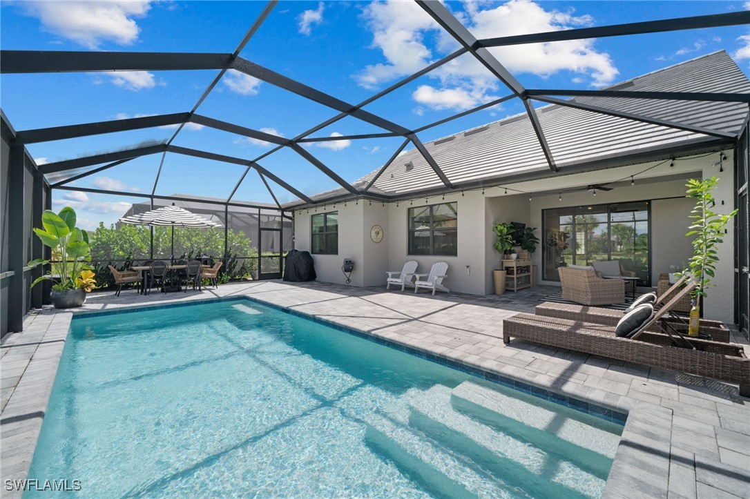 a view of a backyard with plants and a patio