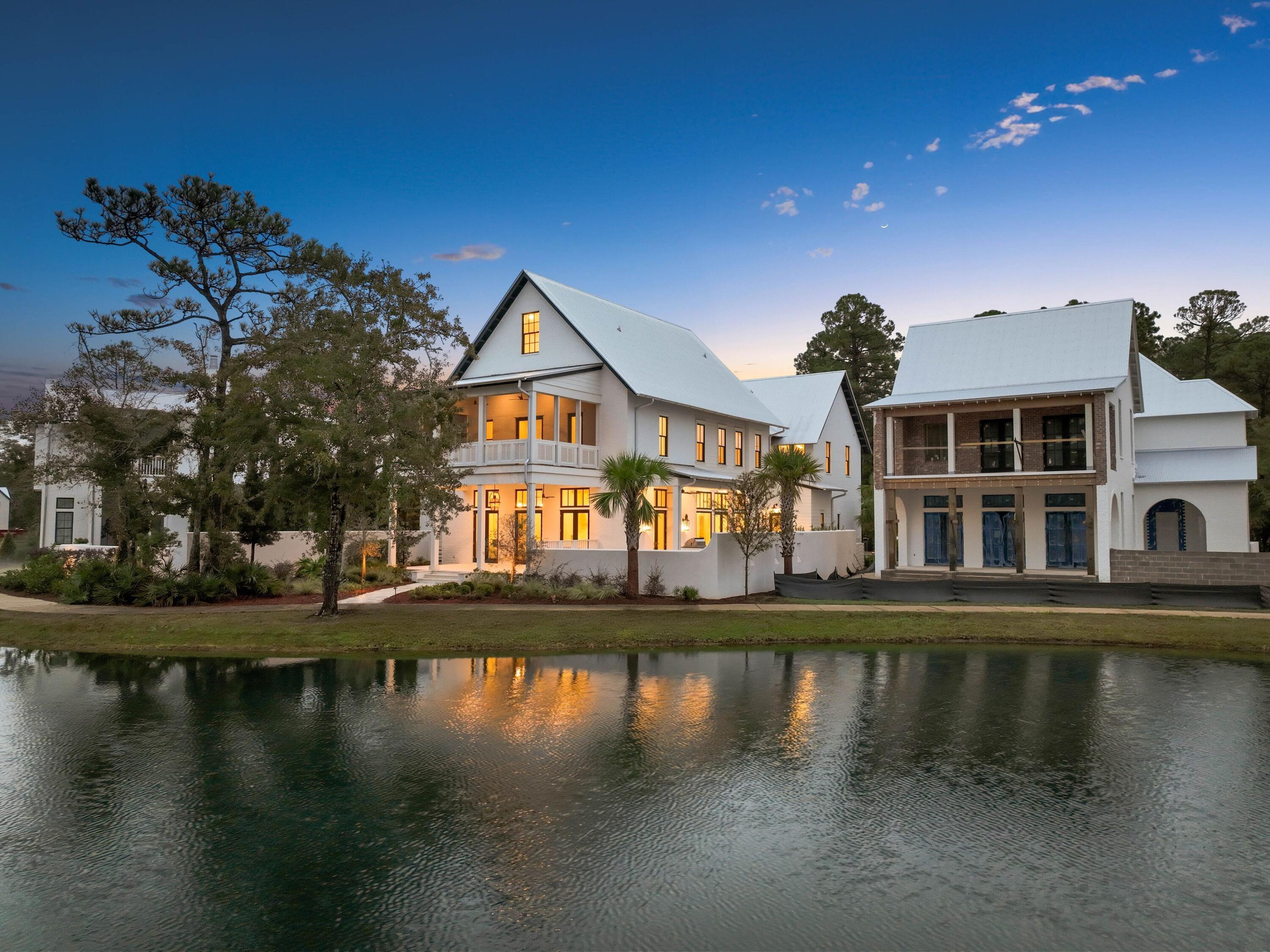 a view of a lake with a house in the background