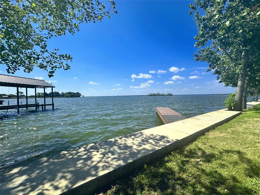 a view of a lake with a big yard