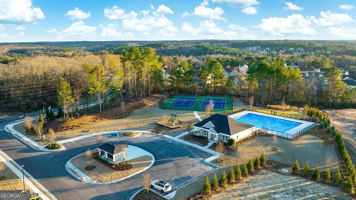 a view of a swimming pool with a patio