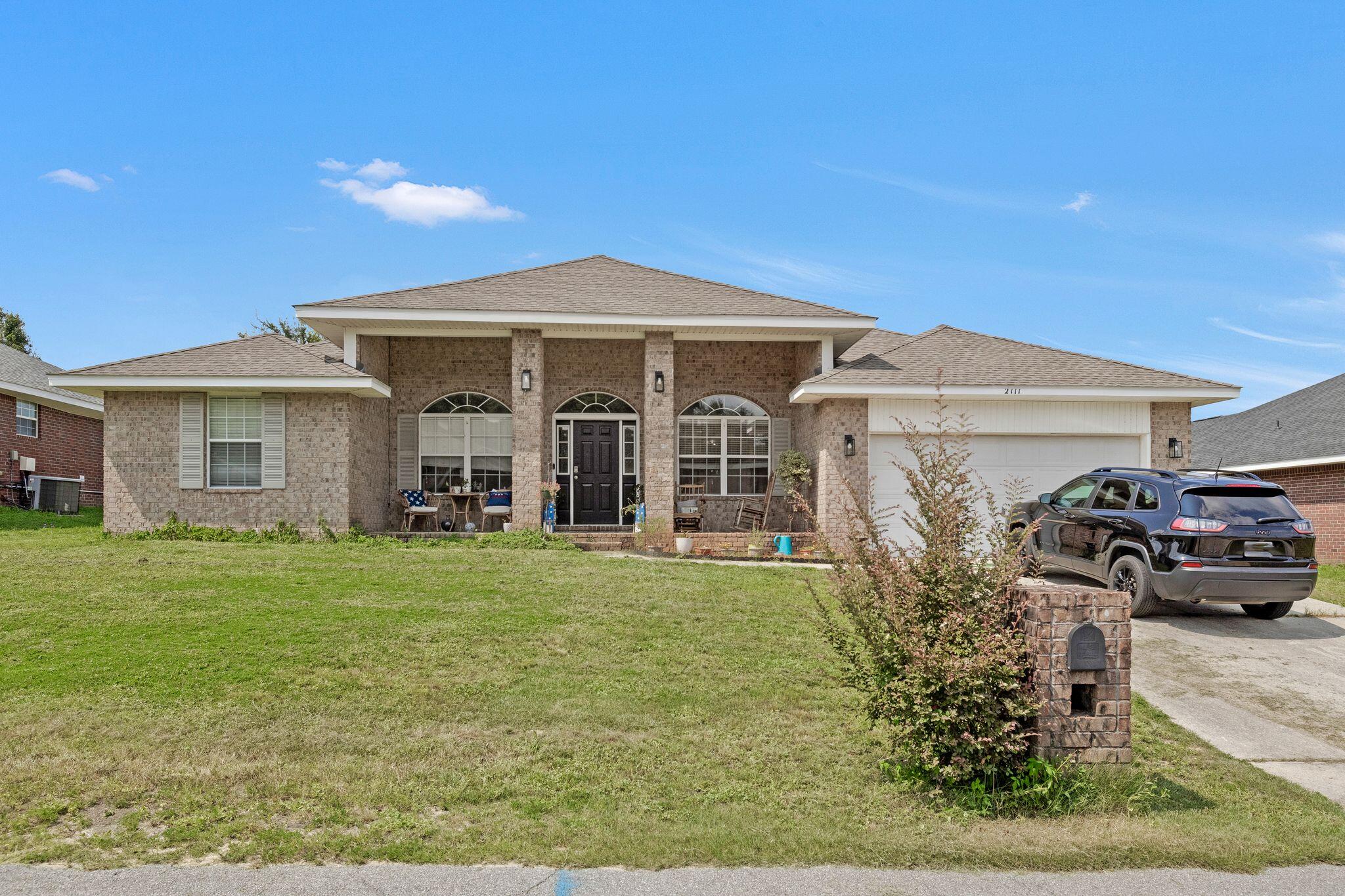 a front view of a house with garden