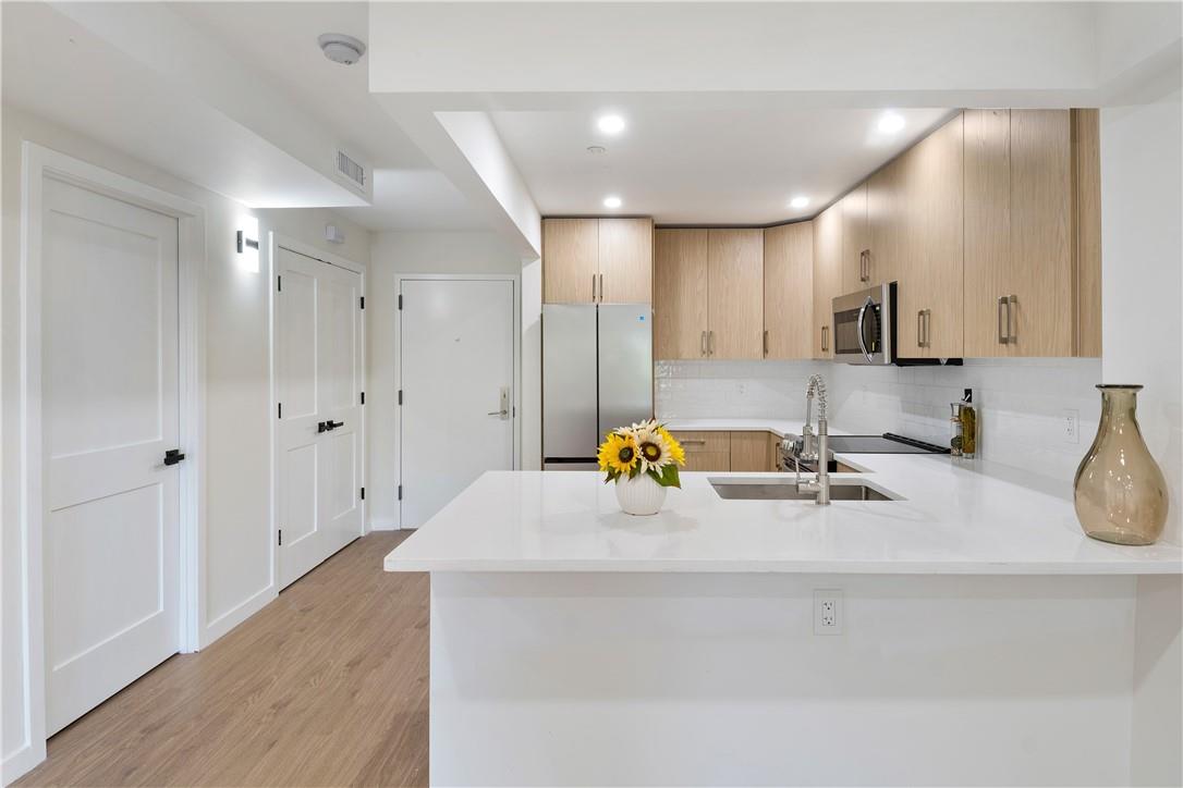 a kitchen with a sink and a refrigerator