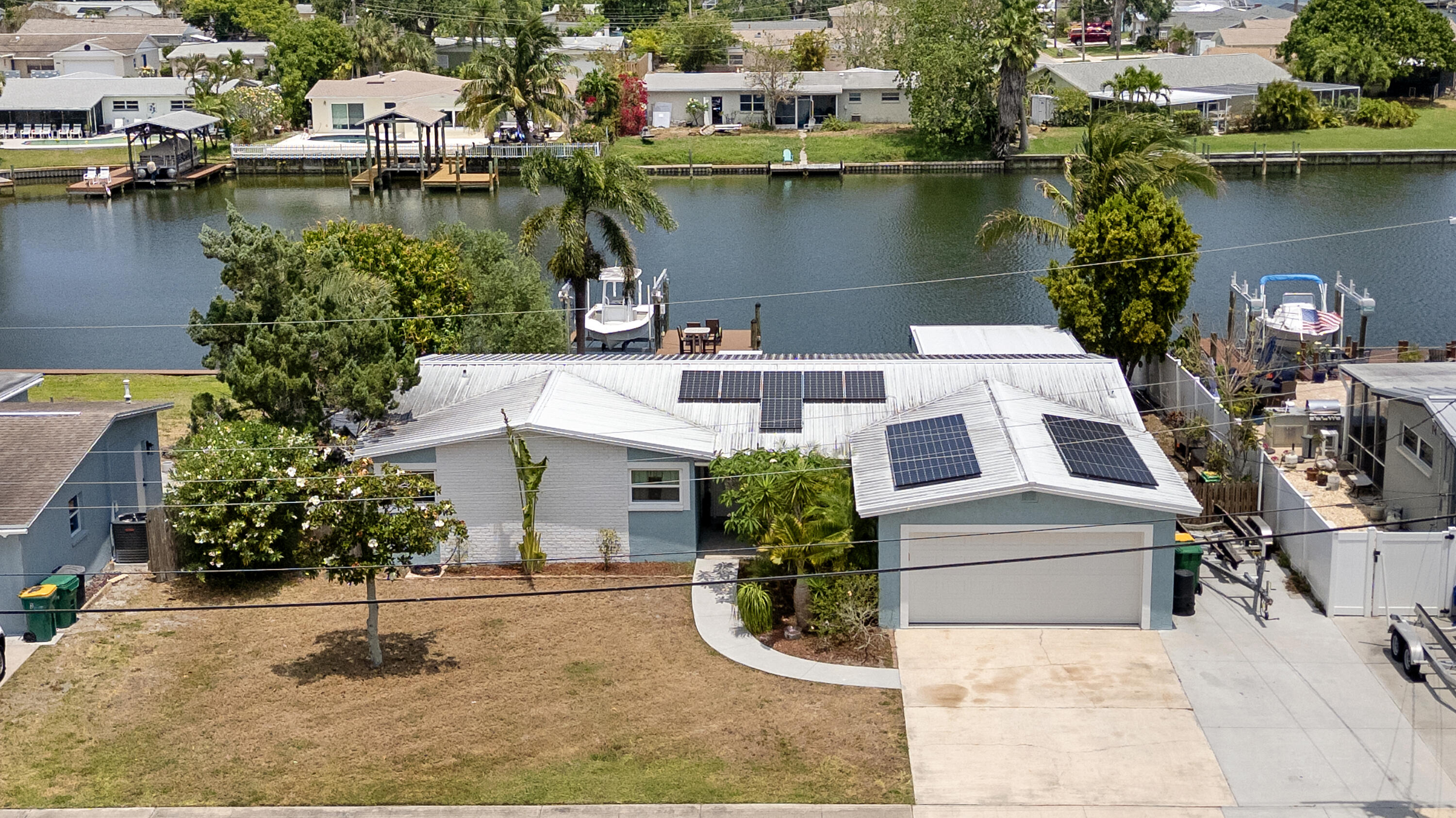 an aerial view of a house with lake view