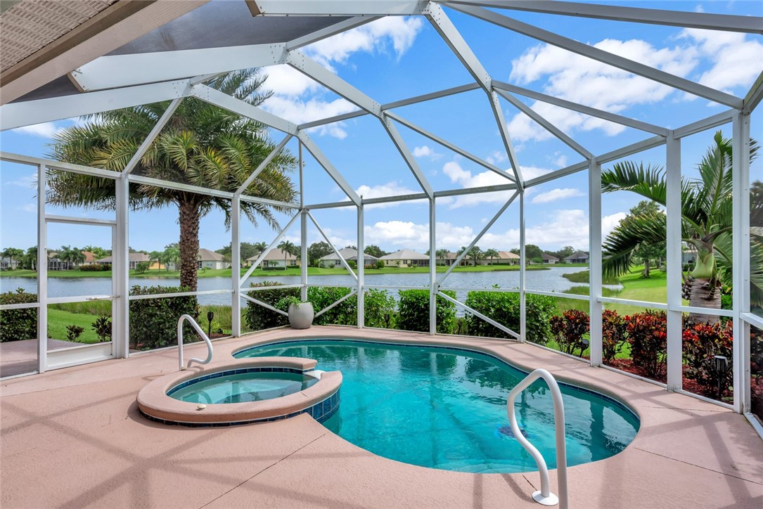 a view of a swimming pool with a patio