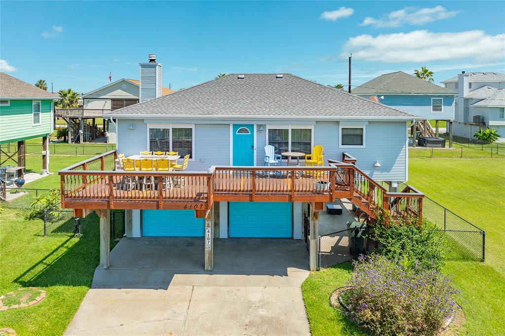 a small swimming pool is sitting in front of a house