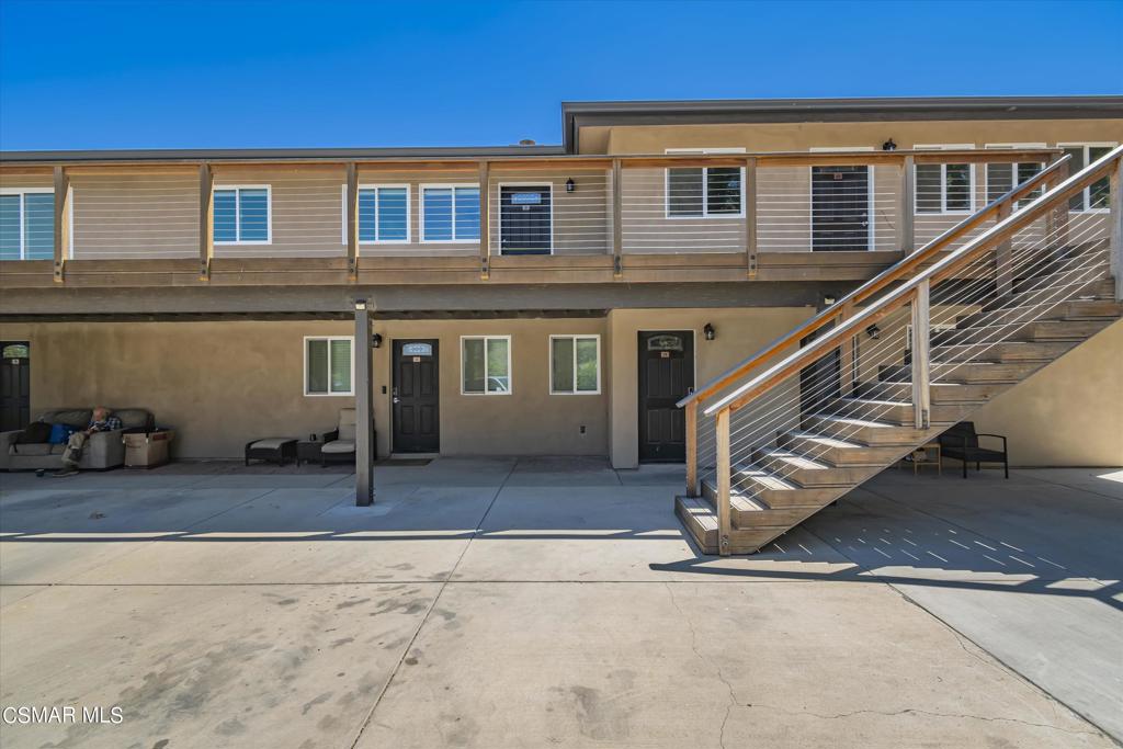 a front view of a house with stairs