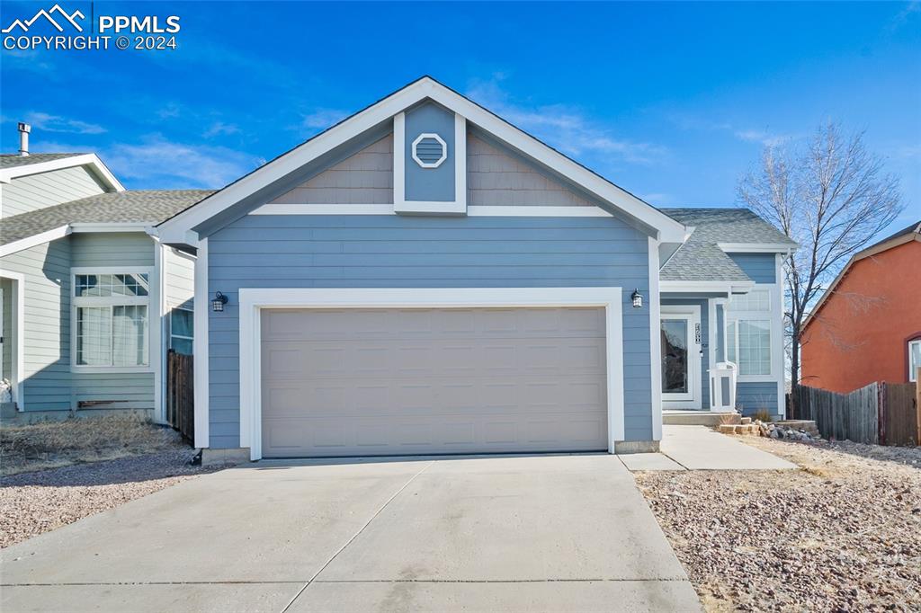 Ranch-style house with a garage