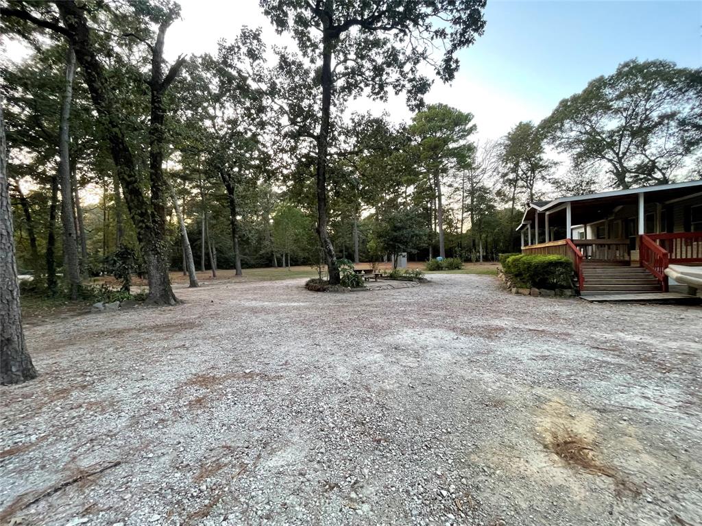 a view of outdoor space with deck and trees