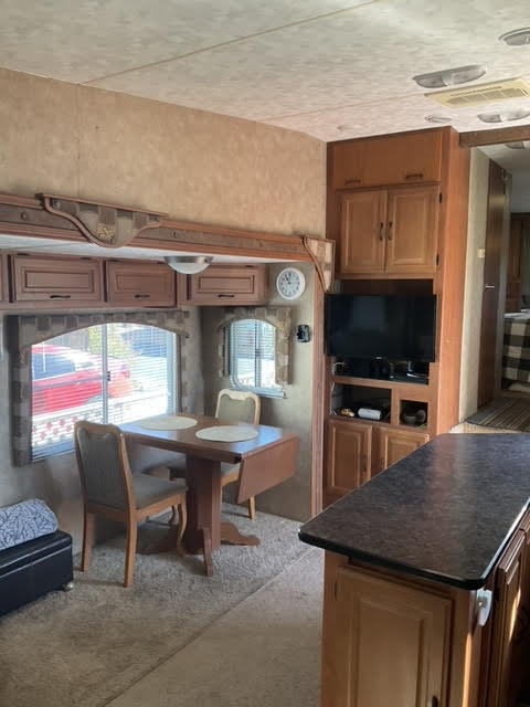 a dining room with a table and chairs