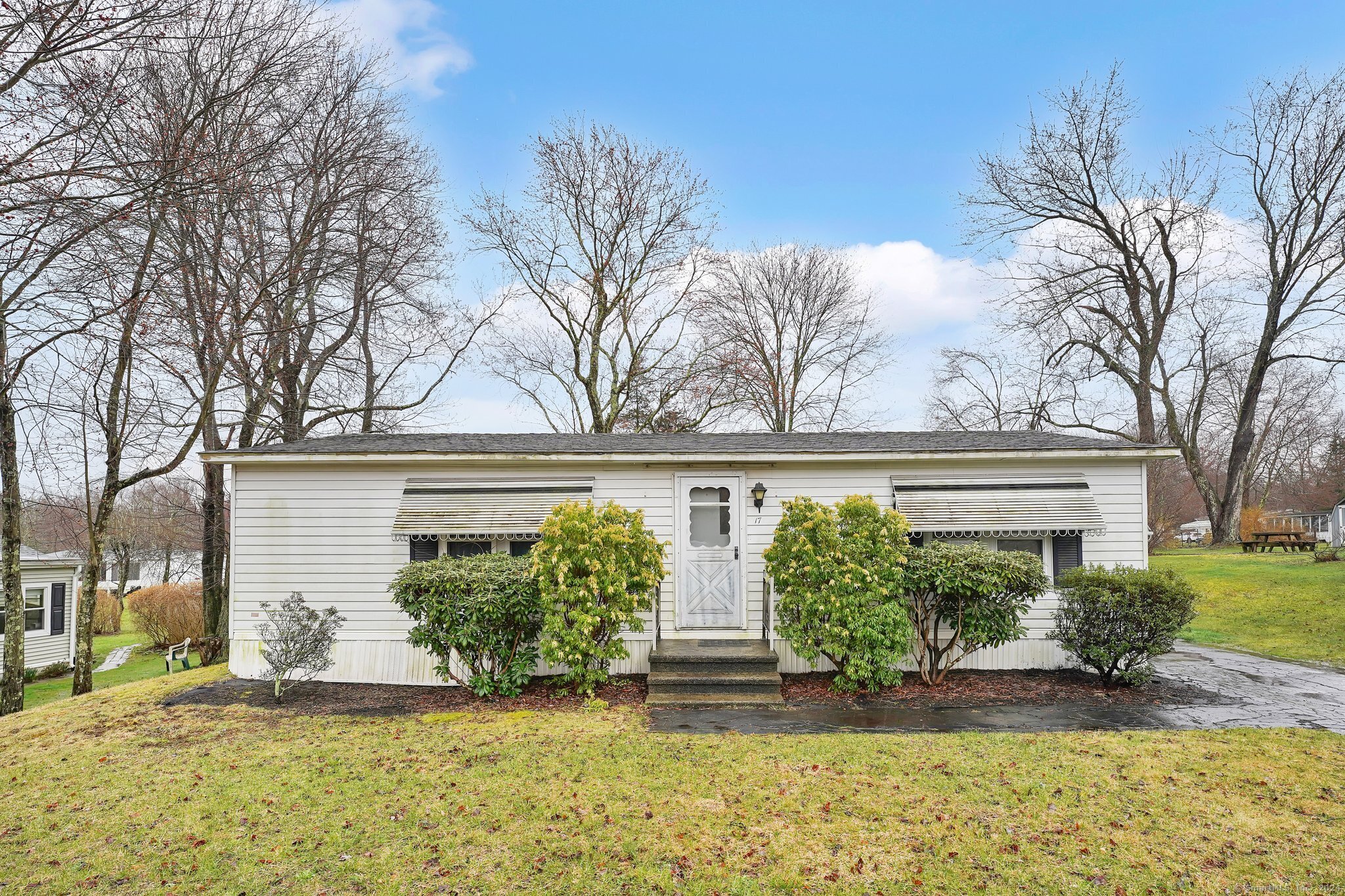 a front view of a house with garden