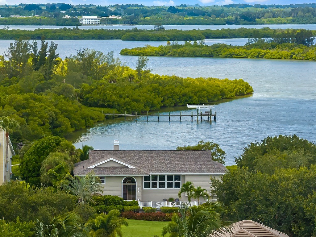 an aerial view of a house with a lake view