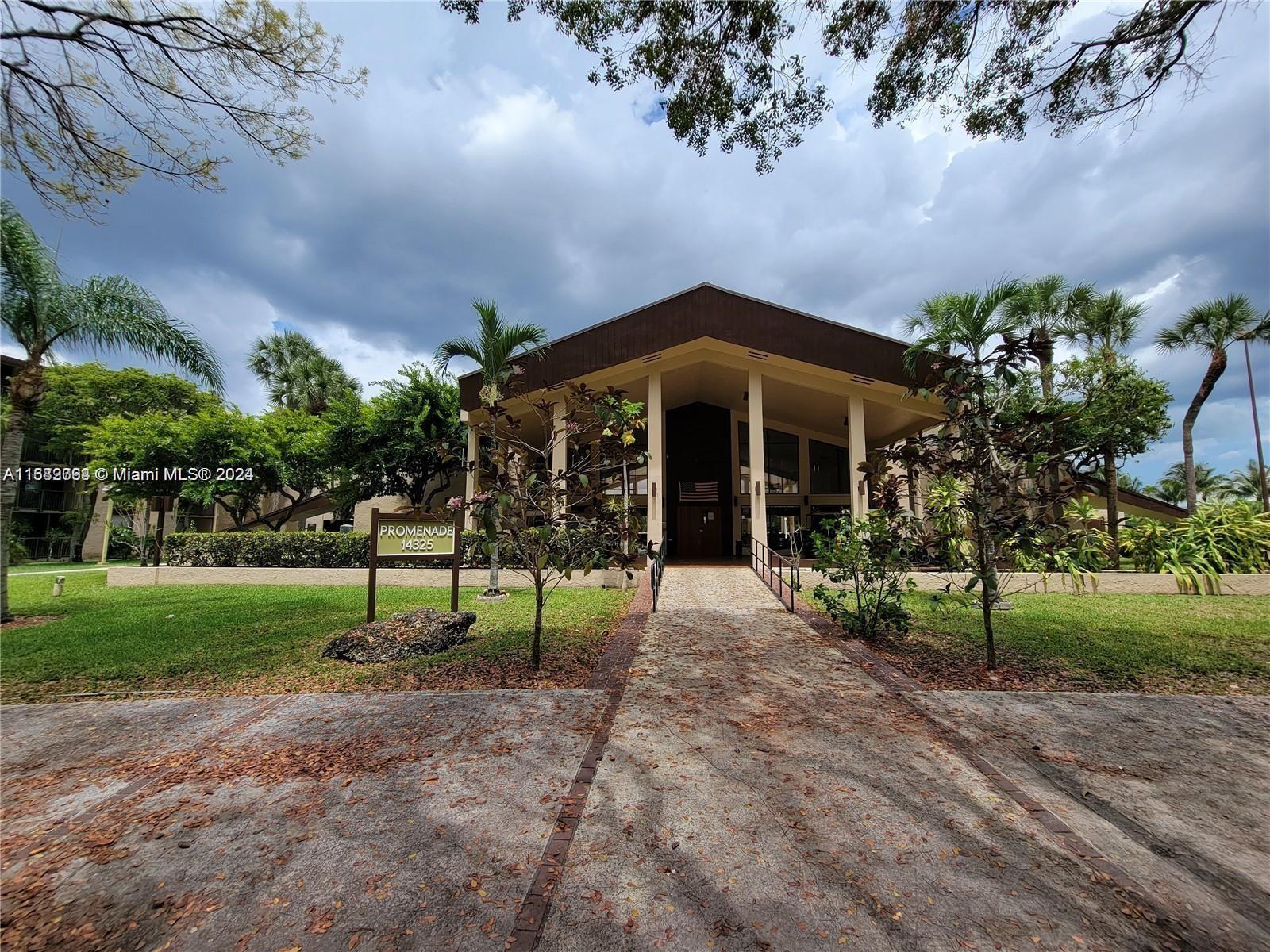 a front view of a house with a yard and porch