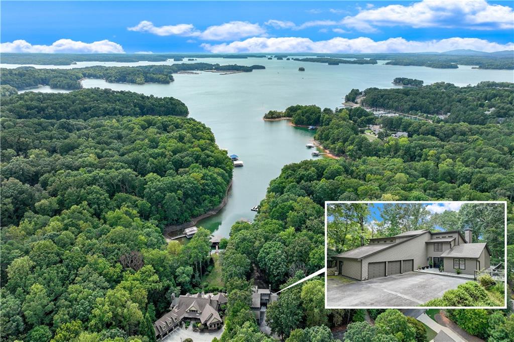 an aerial view of a house with a garden and lake view