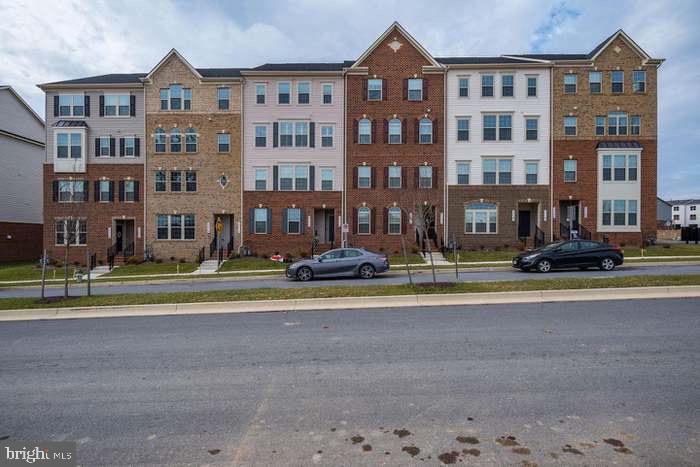 a front view of a building with street view