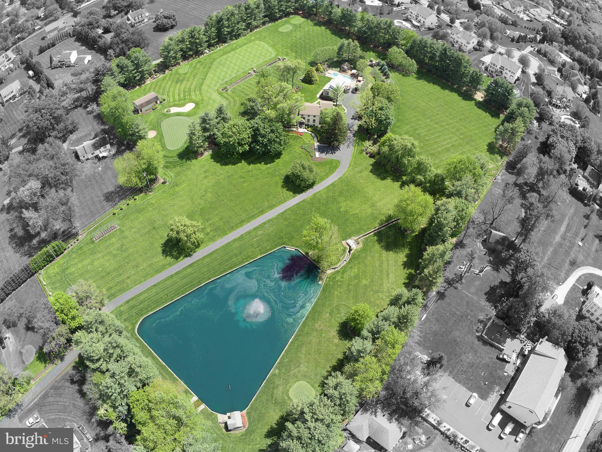 an aerial view of a golf course with parking space