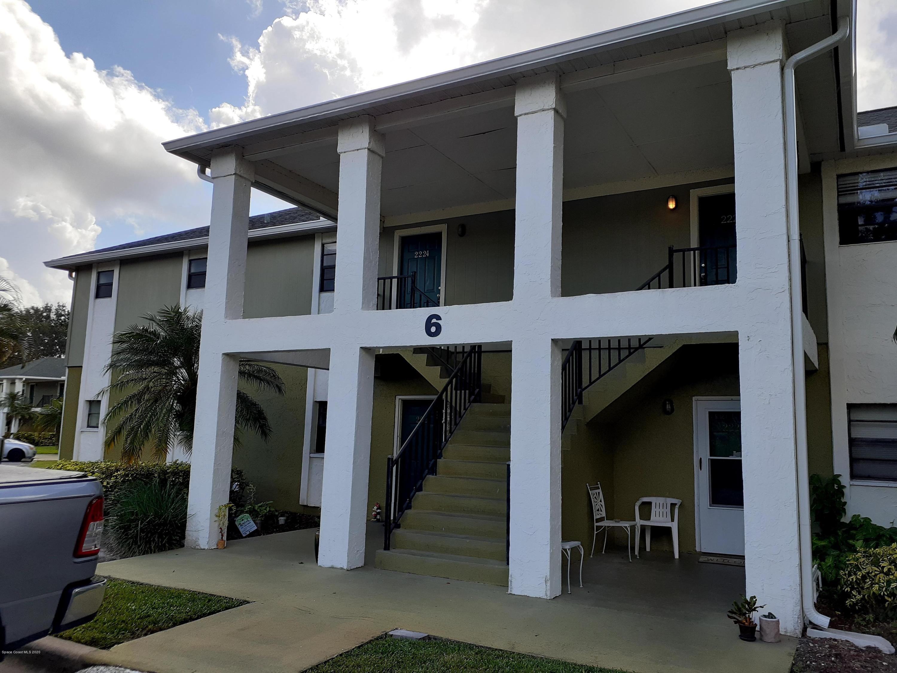 a view of a living room and a balcony