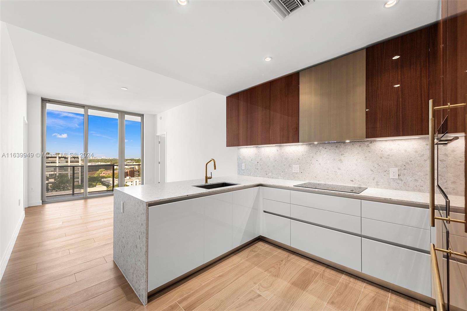 a kitchen with a sink and cabinets