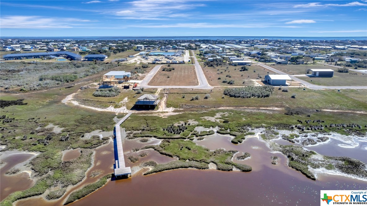 an aerial view of a house with a ocean view