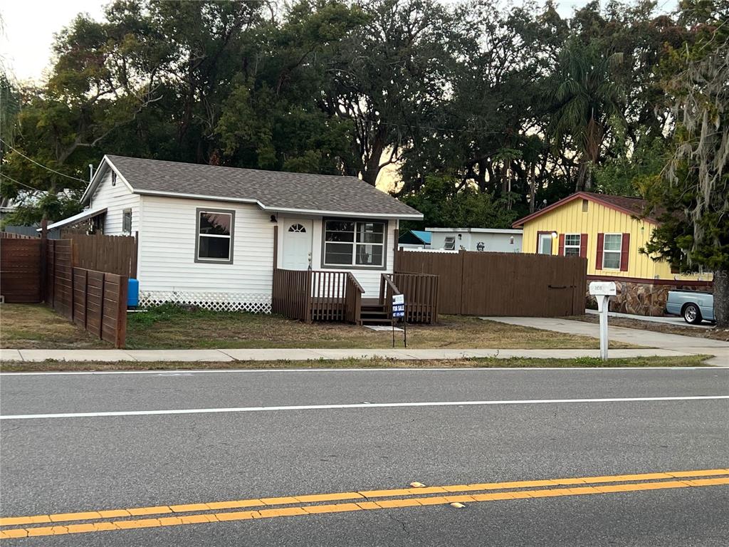 a view of a house with a backyard