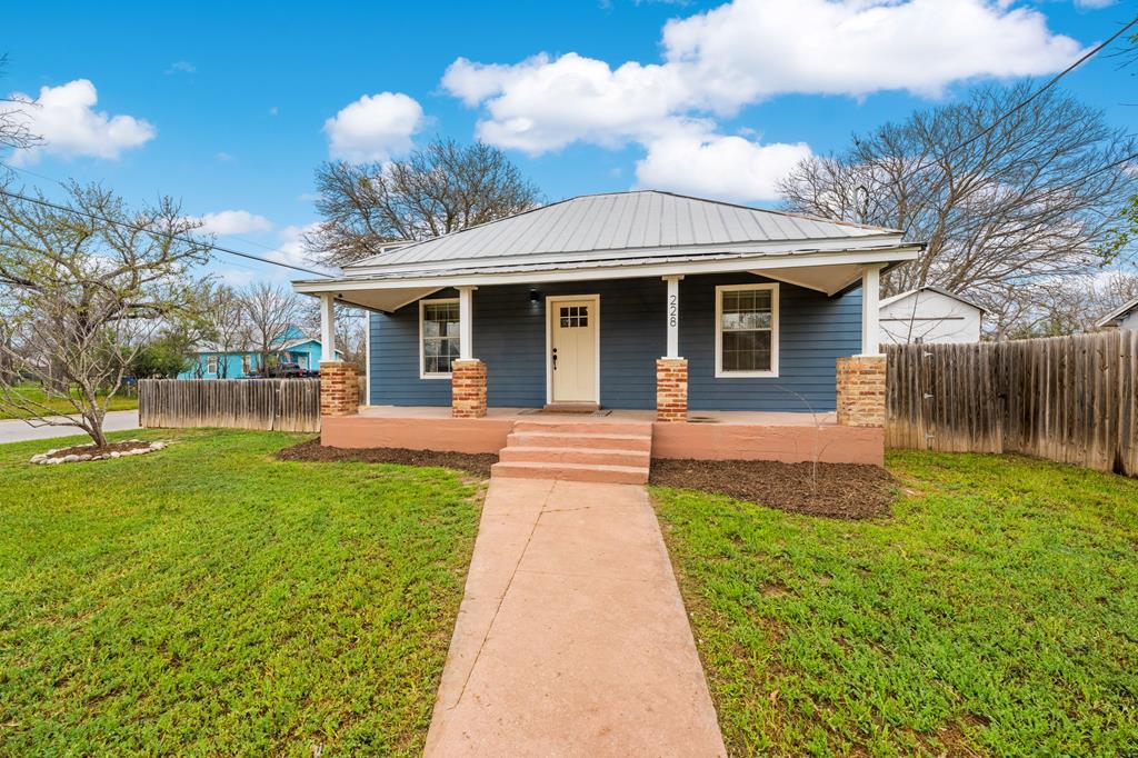 a front view of a house with yard