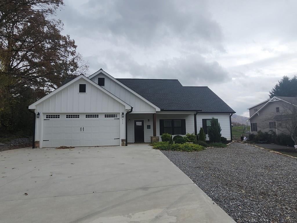 a view of house with a yard