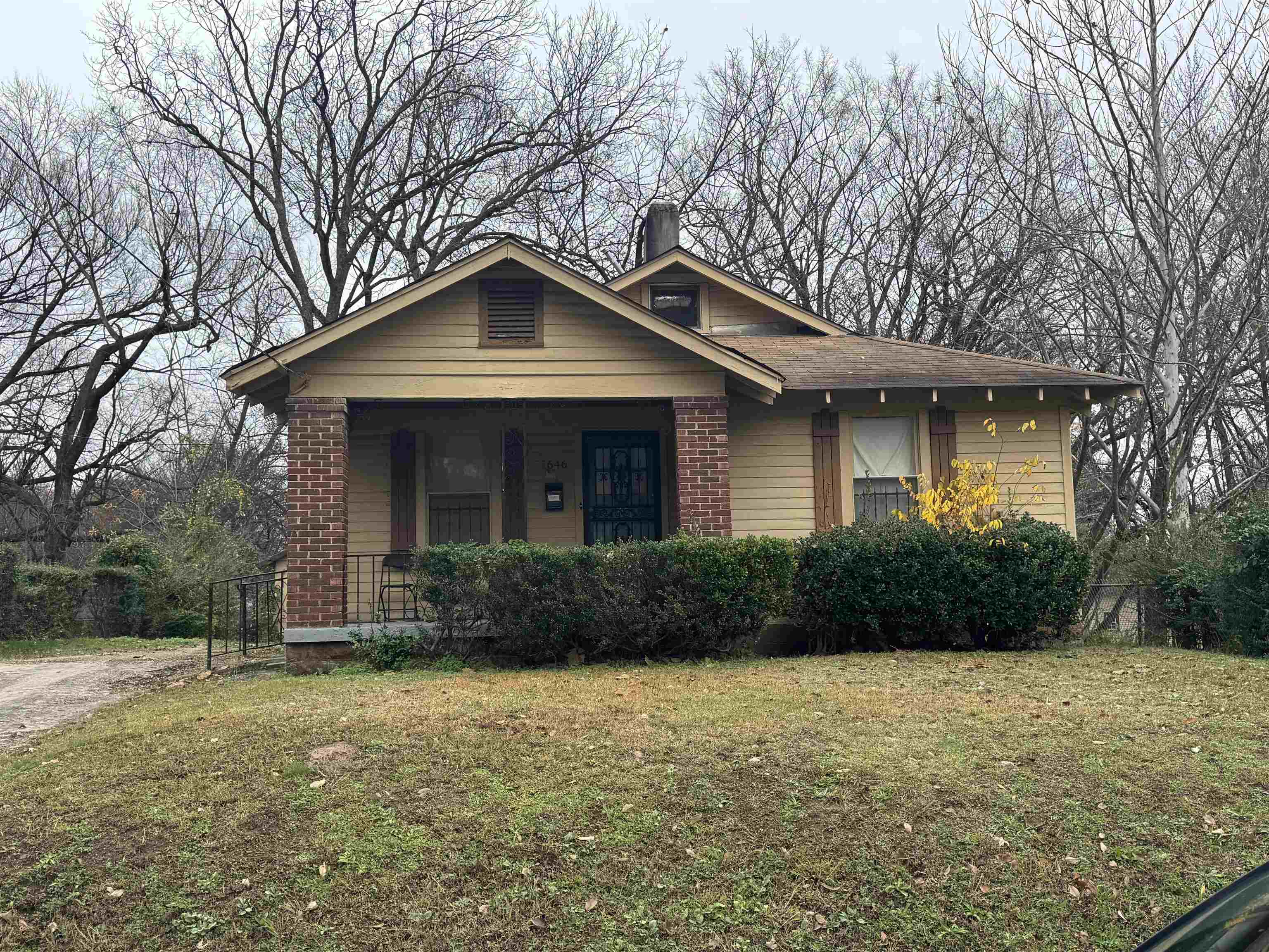 Bungalow-style home featuring a porch and a front yard