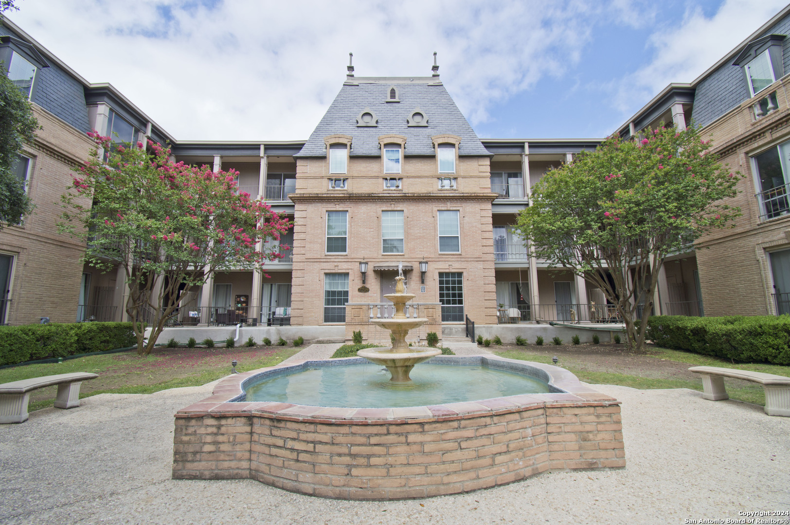 a front view of building with yard