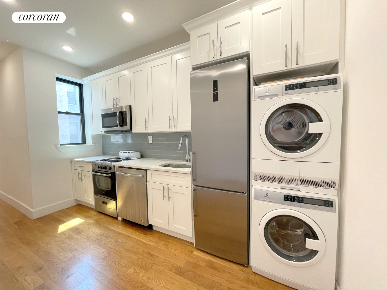 a kitchen with a stove top oven sink and cabinets