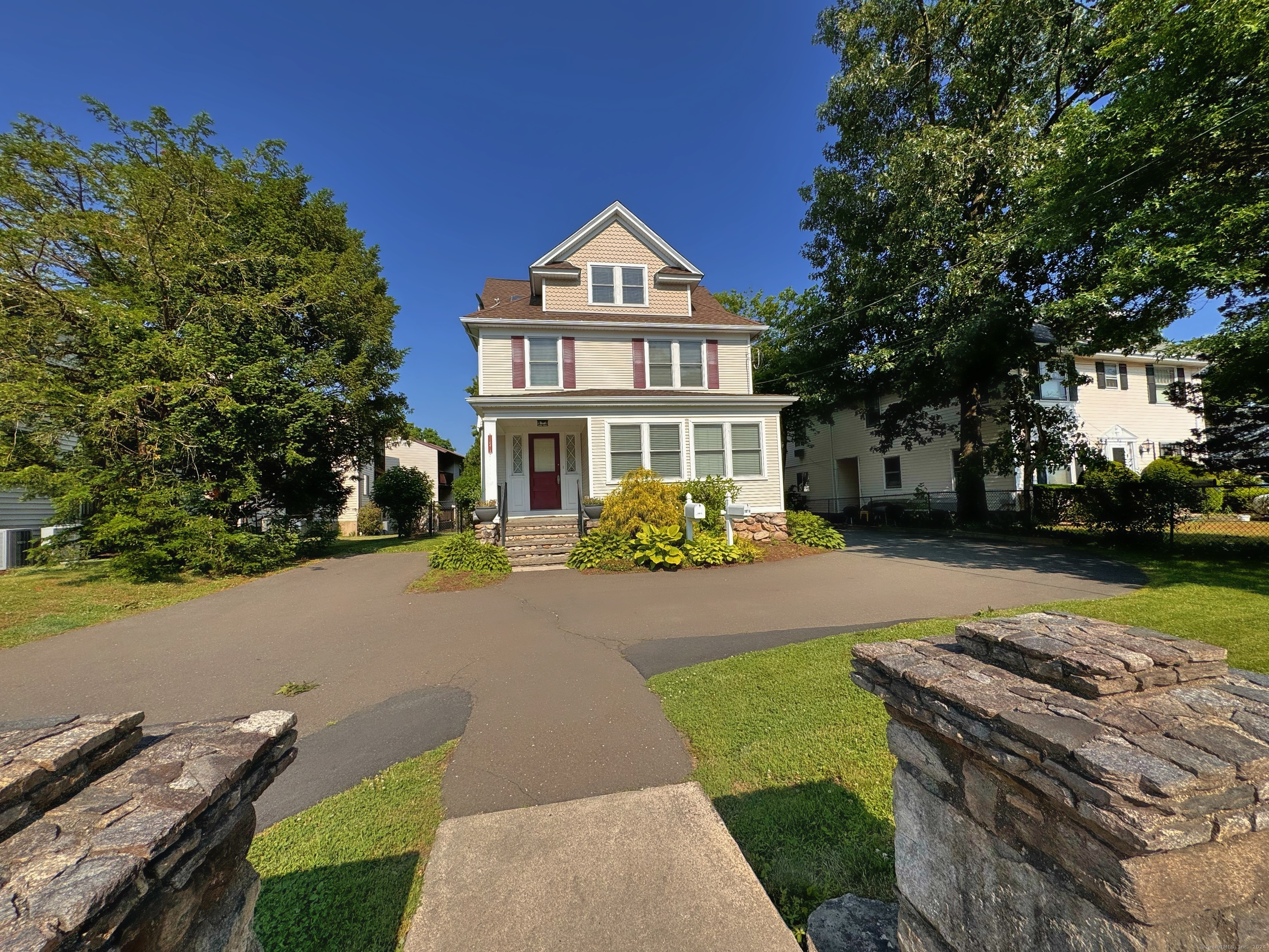 front view of a house with a yard