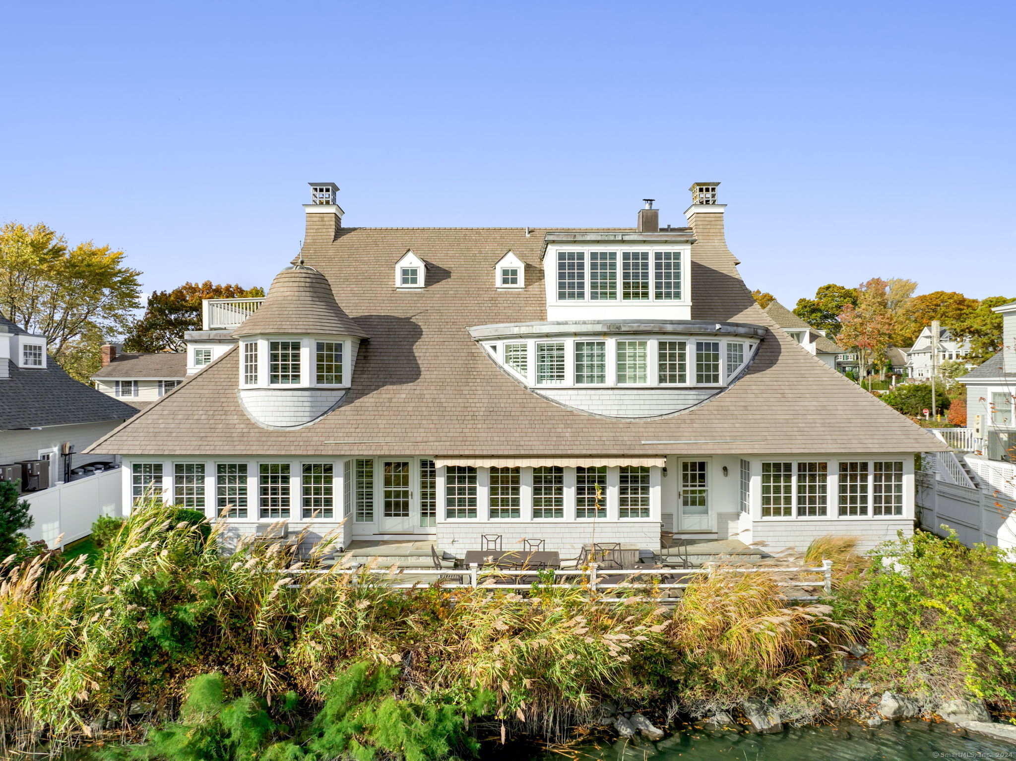 a front view of a house with a swimming pool