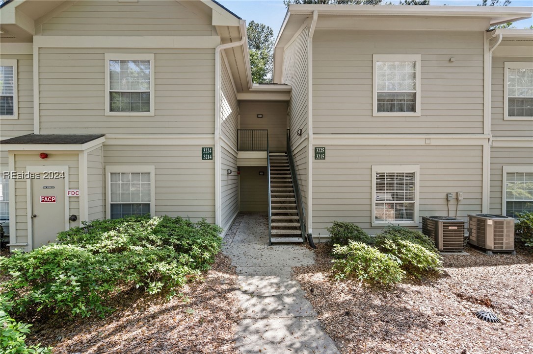 View of front of home featuring central AC unit