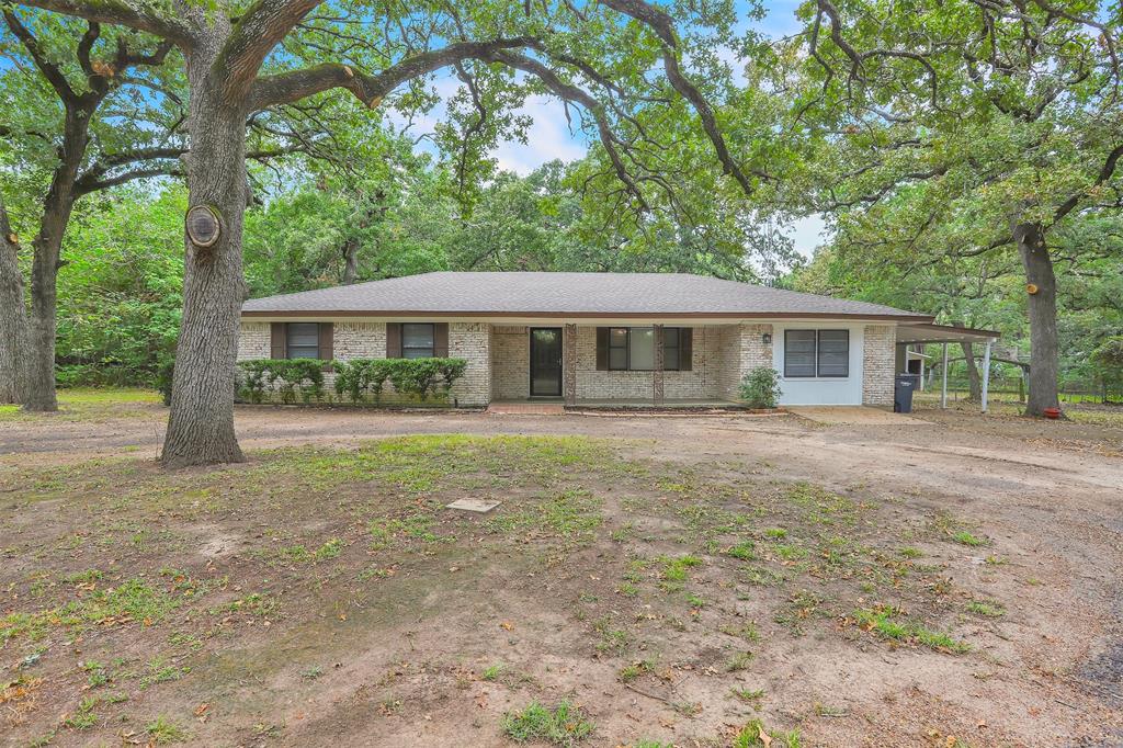 a house with trees in the background