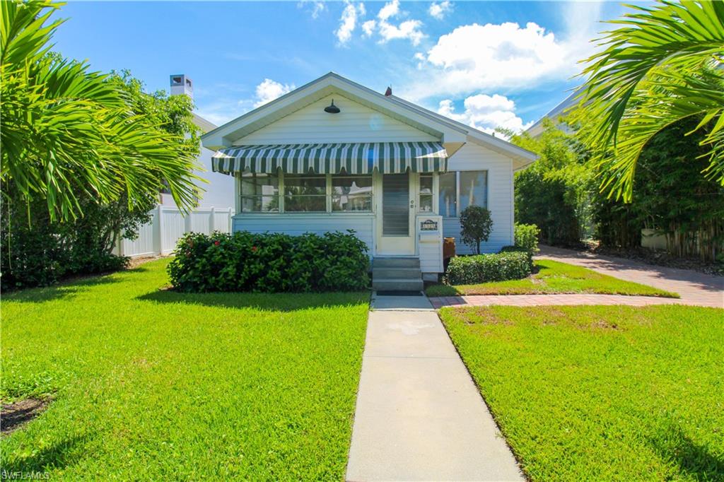 Bungalow-style home featuring a front lawn