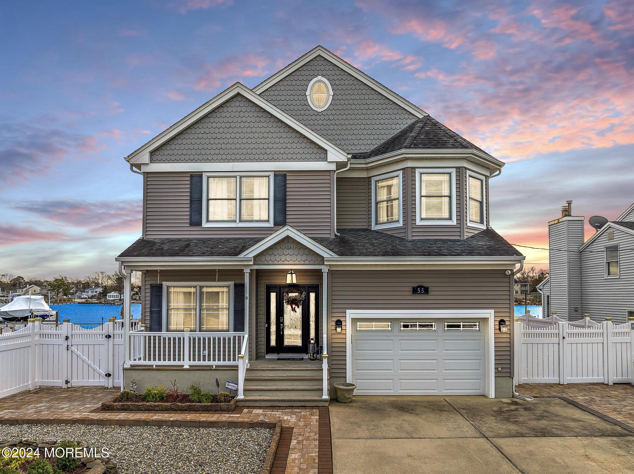 a front view of a house with a garage