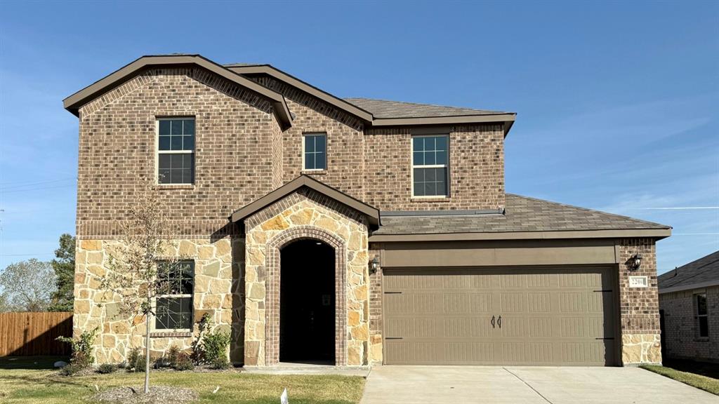 a front view of a house with a garage