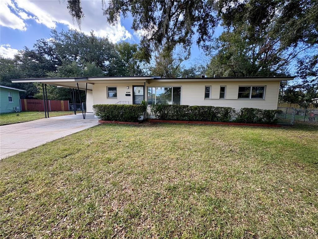 front view of a house with a yard