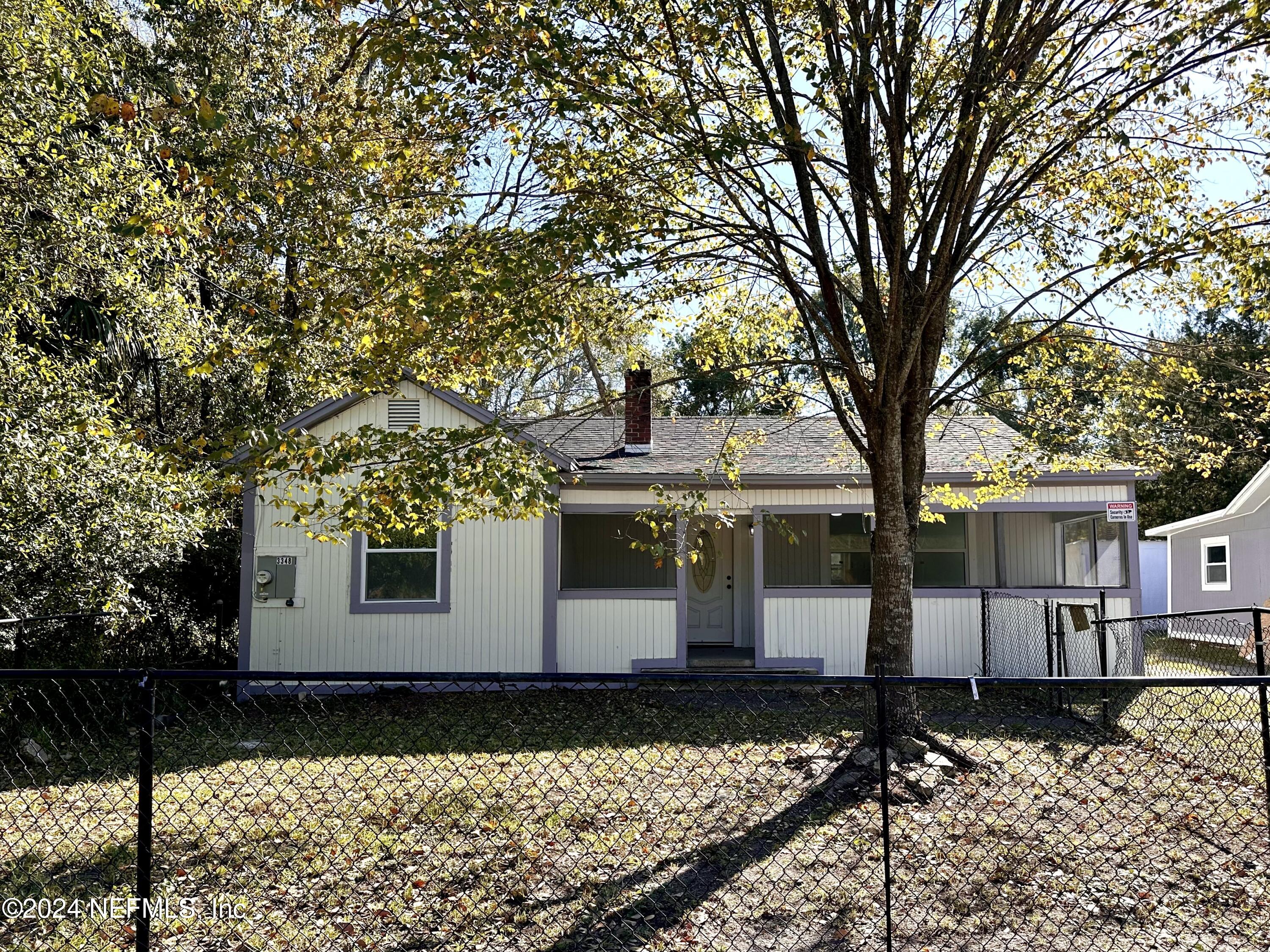 a front view of a house with yard