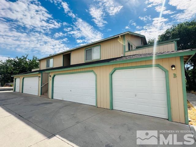 a view of a house with a garage