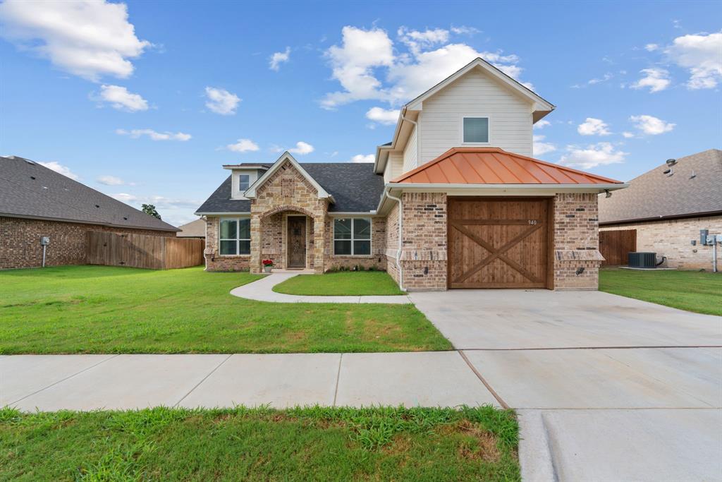 a front view of a house with yard