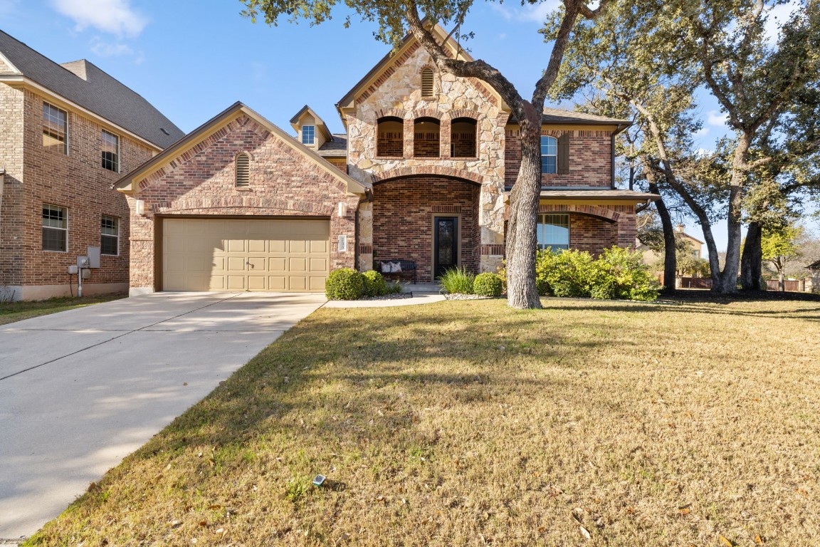 a front view of a house with a yard